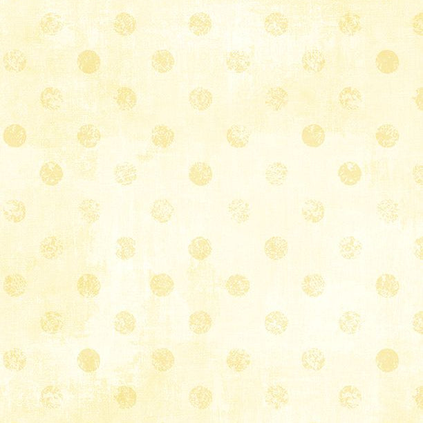 Pattern of small yellow dots on a light yellow background