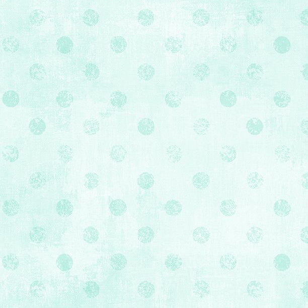 Pattern of small green circles on a light blue background