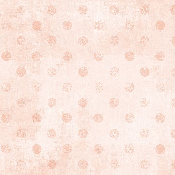 Peach polka dots on a light pink background