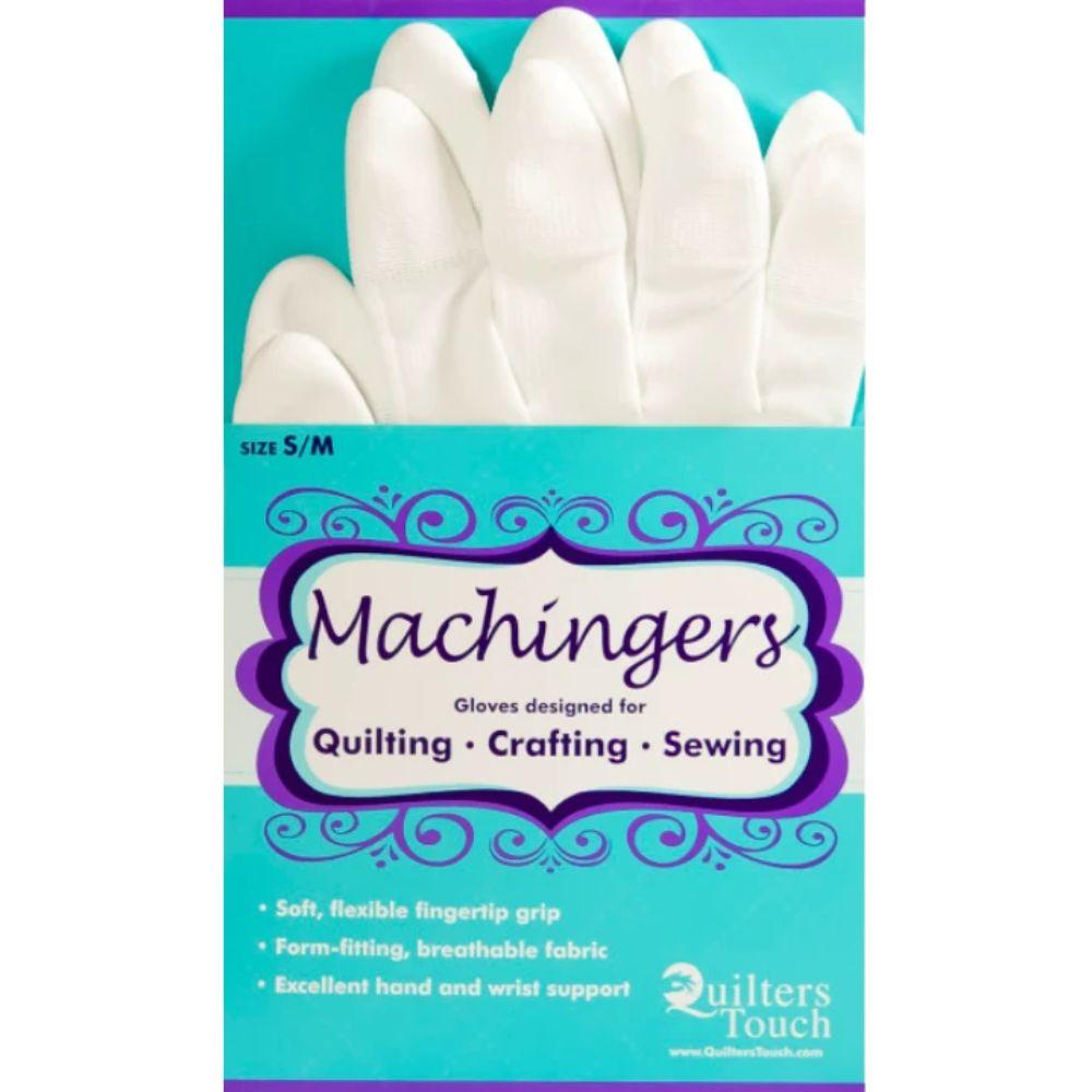 White Machingers sewing gloves shown inside their retail packaging, which features a turquoise background, purple decorative borders, and text indicating they are suitable for quilting, crafting, and sewing.