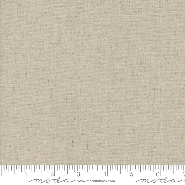 A close-up of a fabric sample from Moda Fabrics, showing a texture of unbleached linen.