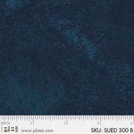 A close-up of a dark navy blue textured fabric swatch with a white ruler along the bottom edge showing scale and text reading SKU: SUED 300 B.