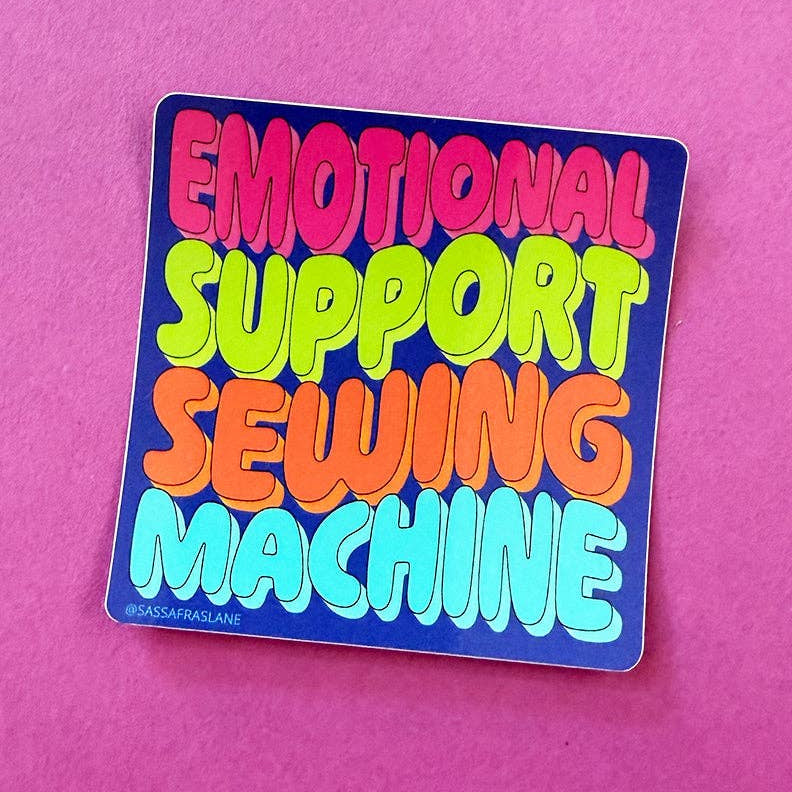 Sticker with 'Emotional Support Sewing Machine' text on a pink background